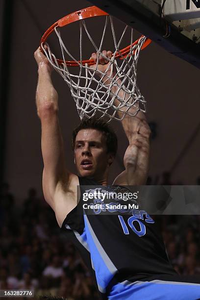 Tom Abercrombie of the Breakers hangs on the hoop after dunking during the round 22 NBL match between the New Zealand Breakers and the Cairns Taipans...