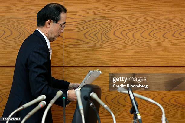 Masaaki Shirakawa, governor of the Bank of Japan, leaves a news conference at the central bank's headquarters in Tokyo, Japan, on Thursday, March 7,...