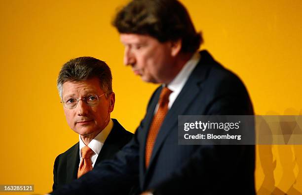 Elmar Degenhart, chief executive officer of Continental AG, left, listens as Wolfgang Schaefer, chief financial officer of Continental AG, speaks...