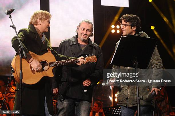 Italian musicians and authors Ron . Luca Carboni and Samuele Bersani performs the Lucio Dalla Tribute at Piazza Maggiore on March 4, 2013 in Bologna,...