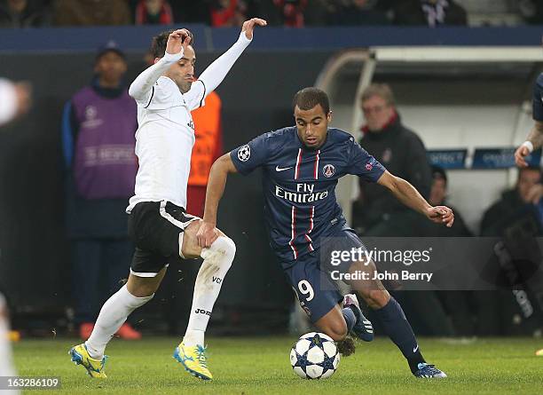 David Albelda of Valence and Lucas Moura of PSG in action during the Champions League match between Paris Saint Germain FC and Valencia CF at the...