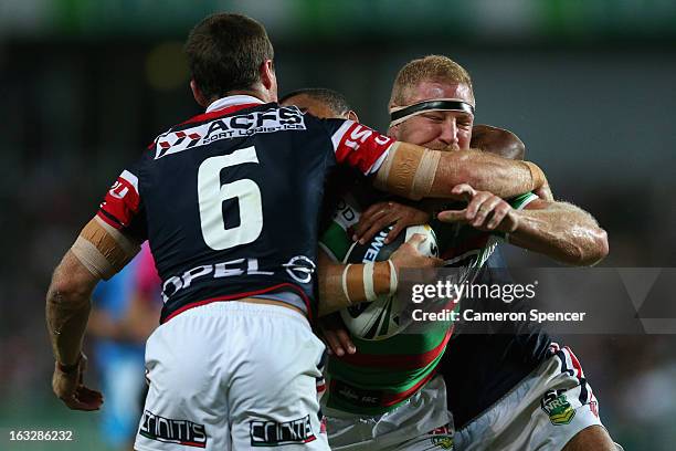 Michael Crocker of the Rabbitohs is tackled during the round one NRL match between the Sydney Roosters and the South Sydney Rabbitohs at Allianz...