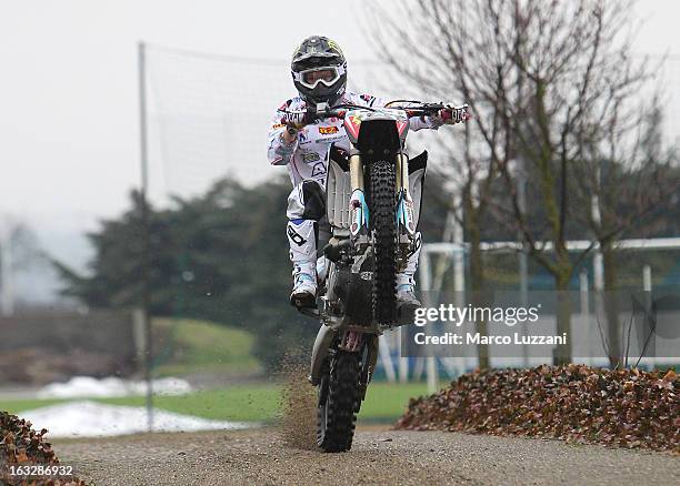 Motocross World Champion Kiara Fontanesi drive her motorbike during a visit to Parma FC at the club's training ground on March 6, 2013 in Collecchio,...