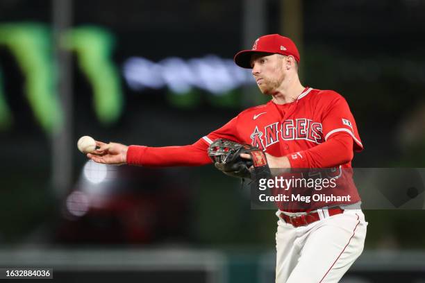 Brandon Drury of the Los Angeles Angels throws to first base for an out against the Cincinnati Reds in the ninth inning at Angel Stadium of Anaheim...
