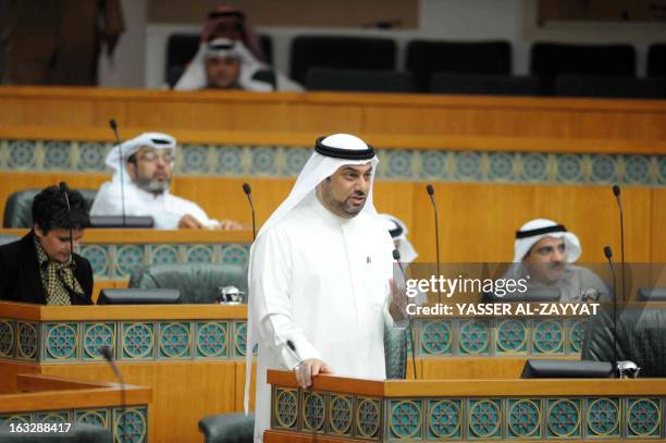 Kuwaiti Shiite MP Yousef al-Zalzalah speaks during a parliament session to discuss the delay in the building of houses in the wealthy Gulf sate at...