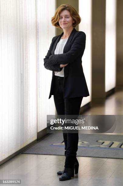 Natalie Nougayrede the newly elected director of the French newpaper Le Monde and the first woman to hold this post, poses on March 7, 2013 at Le...