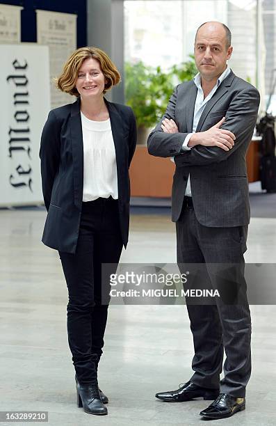 Natalie Nougayrede the newly elected director of the French newpaper Le Monde and the first woman to hold this post poses flanked by the president of...