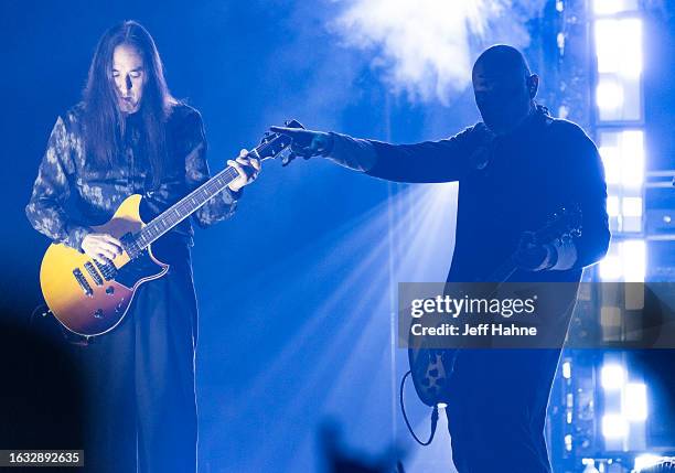 Guitarist Jeff Schroeder and singer/guitarist Billy Corgan of Smashing Pumpkins perform at PNC Music Pavilion on August 22, 2023 in Charlotte, North...