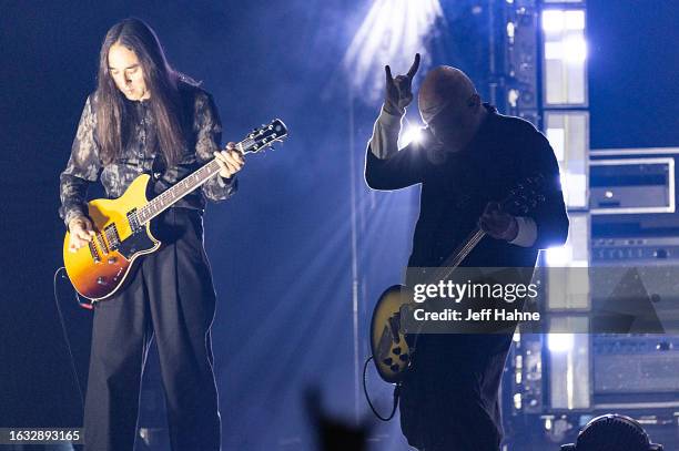 Guitarist Jeff Schroeder and singer/guitarist Billy Corgan of Smashing Pumpkins perform at PNC Music Pavilion on August 22, 2023 in Charlotte, North...