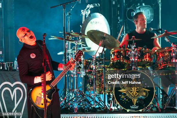 Singer/guitarist Billy Corgan and drummer Jimmy Chamberlin of Smashing Pumpkins perform at PNC Music Pavilion on August 22, 2023 in Charlotte, North...