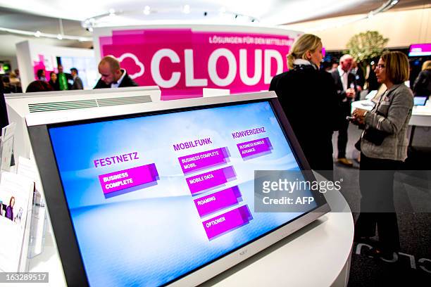 Screen is seen at the telecoms stand at the 2013 CeBIT technology trade fair on March 5, 2013 in Hanover, Germany. CeBIT will be open March 5-9. AFP...