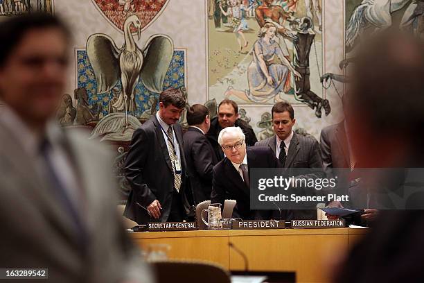 Russia's U.N. Ambassador Vitaly Churkin , the current council president, prepares to vote at a U.N. Security Council meeting on imposing a fourth...