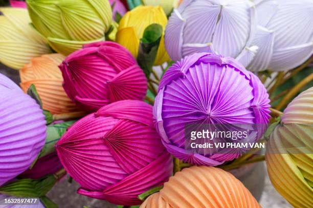 multi-colored sacred lotus flowers made from paper - ikebana stock pictures, royalty-free photos & images
