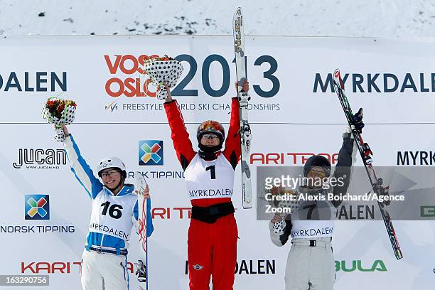 Mengtao Xu of China takes first place, Veronika Korsunova of Russia takes second place, Danielle Scott of Australia takes third place during the FIS...