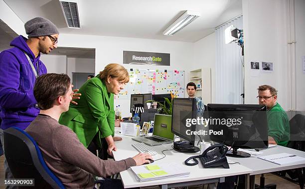 German Chancellor Angela Merkel visits the company Research Gate on March 7, 2013 in Berlin, Germany. Chancellor Merkel and Economy Minister Philipp...