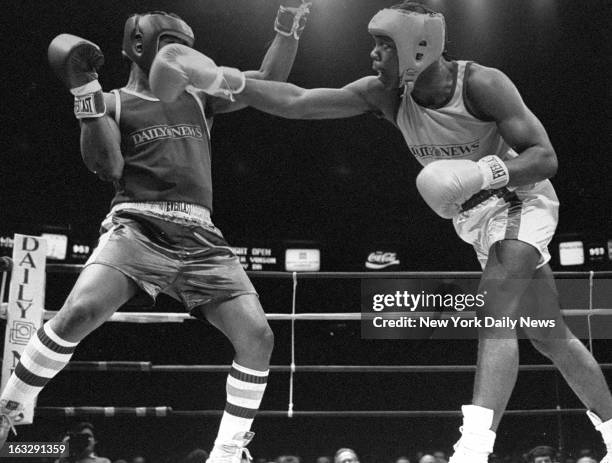 Heavyweight Michael Bentt throws a long right hand at Webster Vinson in the 1986 Golden Gloves final. The first five-time national champion Bentt...