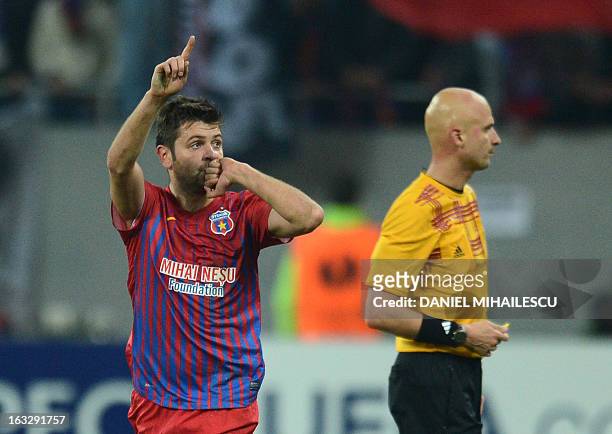 Raul Rusescu of Steaua Bucharest celebrates after he scored 1-0 against Chelsea during the UEFA Europa League Round of 16 first leg football match FC...