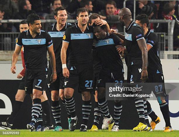 Ogenyi Onazi of Lazio celebrates his team's second goal with team mates during the UEFA Europa League round of sixteen first leg match between VfB...