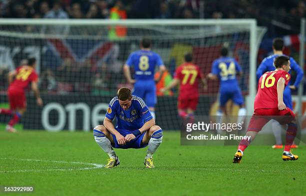 Raul Rusescu of FC Steaua scores a penalty past Petr Cech of Chelsea as Fernando Torres of Chelsea looks down during the UEFA Europa League Round of...