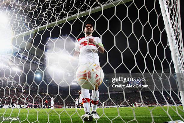 Serdar Tasci of Stuttgart reacts after Ogenyi Onazi of Lazio scored his team's second goal during the UEFA Europa League round of 16 first leg match...