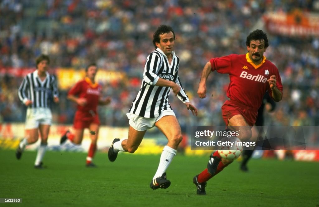 Michel Platini of Juventus and Emidio Oddi of Roma