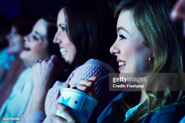 geeky guy and girl on a date at the movies - alleen jonge vrouwen stockfoto's en -beelden