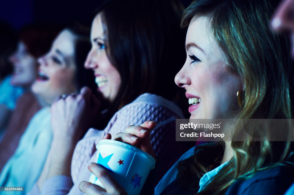 Geeky guy and girl on a date at the movies