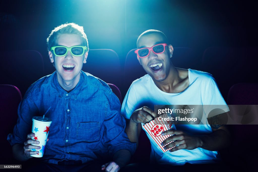 Friends at the cinema wearing 3D glasses