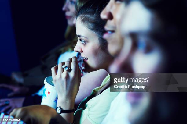 geeky guy and girl on a date at the movies - her film 2013 stock pictures, royalty-free photos & images
