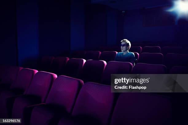 man watching a movie in empty cinema - 3d glasses stock pictures, royalty-free photos & images
