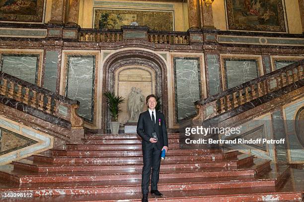 French journalist and author Stephane Bern poses with his insignia and certificate at Palais d'Egmont after he was appointed officer in the King...
