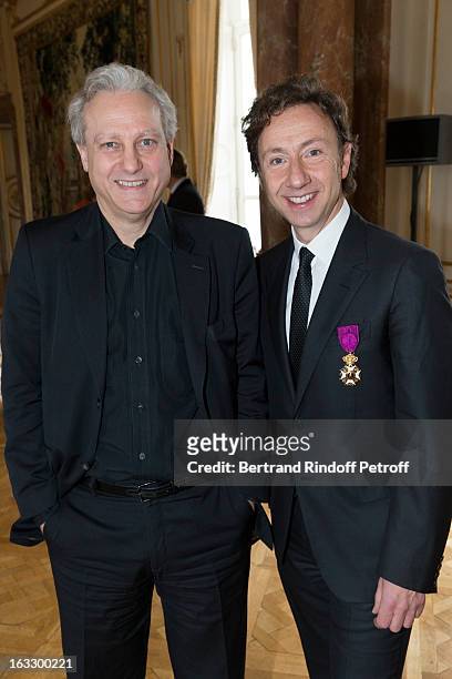 French journalist and author Stephane Bern and Yves Bigot, CEO TV5, pose after Bern was appointed officer in the King Leopold order during a ceremony...