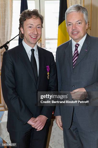 French journalist and author Stephane Bern and Belgian Forein Minister and Vice Prime Minister Didier Reynders pose after Bern was appointed officer...