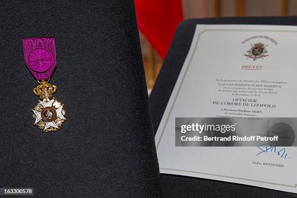 The insignia and certificate of French journalist and author Stephane Bern are seen at Palais d'Egmont prior Bern to be appointed officer in the King...