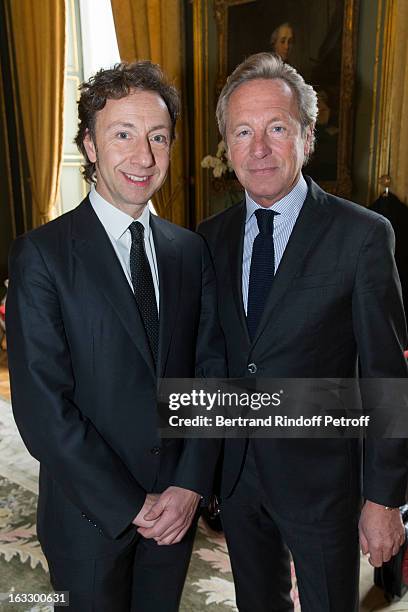 French journalist and author Stephane Bern and Belgian fashion designer Edouard Vermeulen pose prior Bern to be appointed officer in the King Leopold...