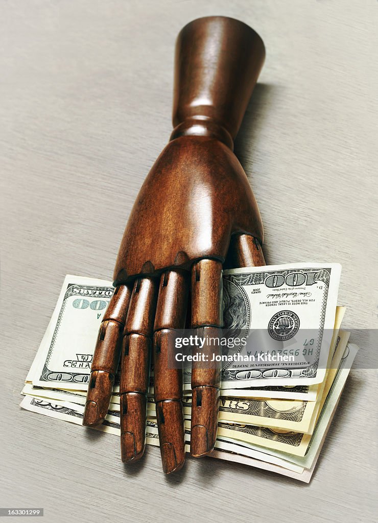 Hand with spread of dollars