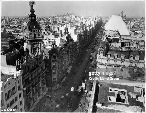 An air view of Avenida De Mayo with buildings towering over it as far as the eyes can see in Buenos Aires, Argentina, 1955.