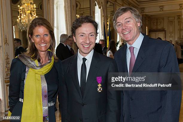 French journalist and author Stephane Bern poses with Belgian Ambassador to France Patrick Vercauteren Drubbel and his wife Alessandra Vercauteren...