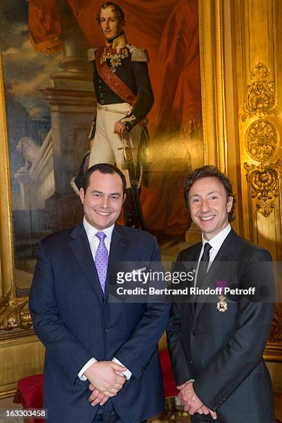 French journalist and author Stephane Bern and Belgian reporter Thomas de Bergeyck pose by a painting of King Leopold I of Belgium after Bern was...