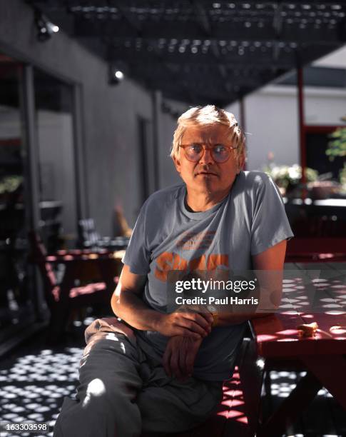 English artist David Hockney poses for a portrait on the patio of his Hollywood Hills home in April 1991, in Los Angeles, California.