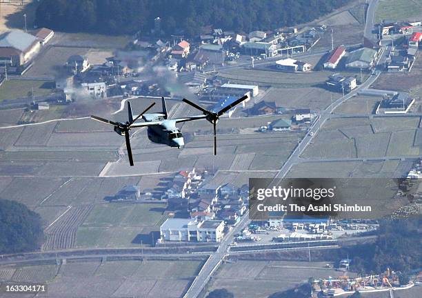 In this aerial image, an U.S. Marines' MV-22 Osprey aircraft is seen conducting first ever low altitude flight training over Japanese mainland, while...