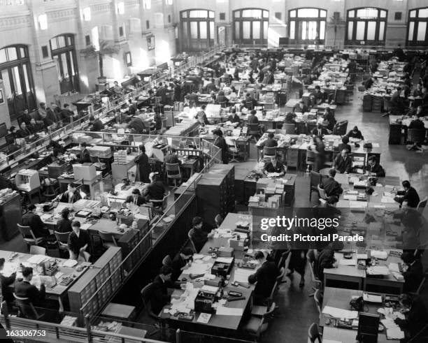 General view of clerks working at one of the largest banks in Japan, 1955.