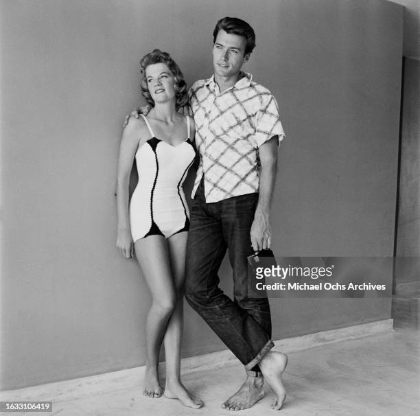 Maggie Johnson, wearing a swimsuit, beside her husband, American actor and film director Clint Eastwood at their home in Los Angeles, California, 9th...
