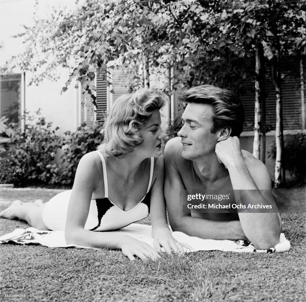 American model Maggie Johnson, wearing a swimsuit, and her husband
