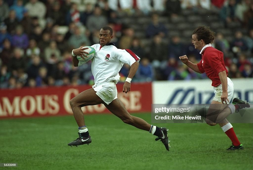 Andrew Harriman of England powers forwards with the ball