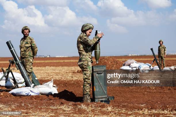 Turkey-backed Syrian fighters take part in a military training near the town of Marea in the rebel-controlled northern part of Syria's Aleppo...