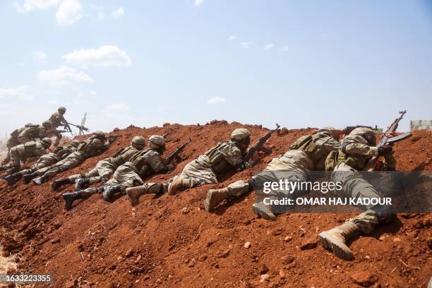 Turkey-backed Syrian fighters take part in a military training near the town of Marea in the rebel-controlled northern part of Syria's Aleppo...