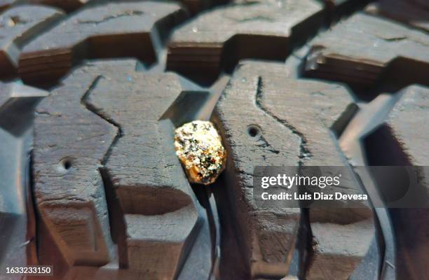 Rocks In Tires 333 Chipped Granite Stock Photos, High-Res Pictures, and Images - Getty ...