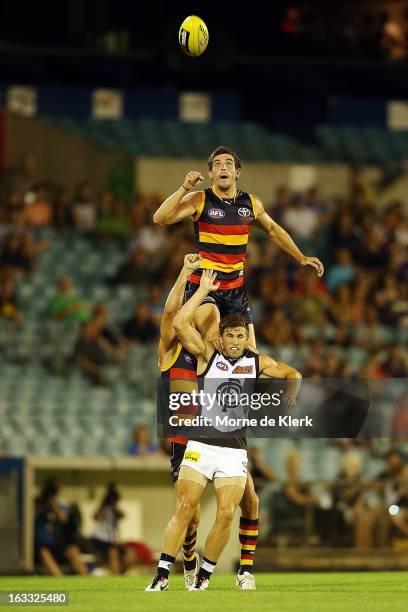 Ricky Henderson of the Crows gets high to spoil the ball during the round three NAB Cup AFL match between the Adelaide Crows and the Carlton Blues at...