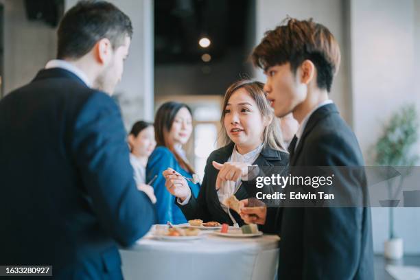 group of multiracial asian business participants casual chat tea break conference event - banquet hall stockfoto's en -beelden
